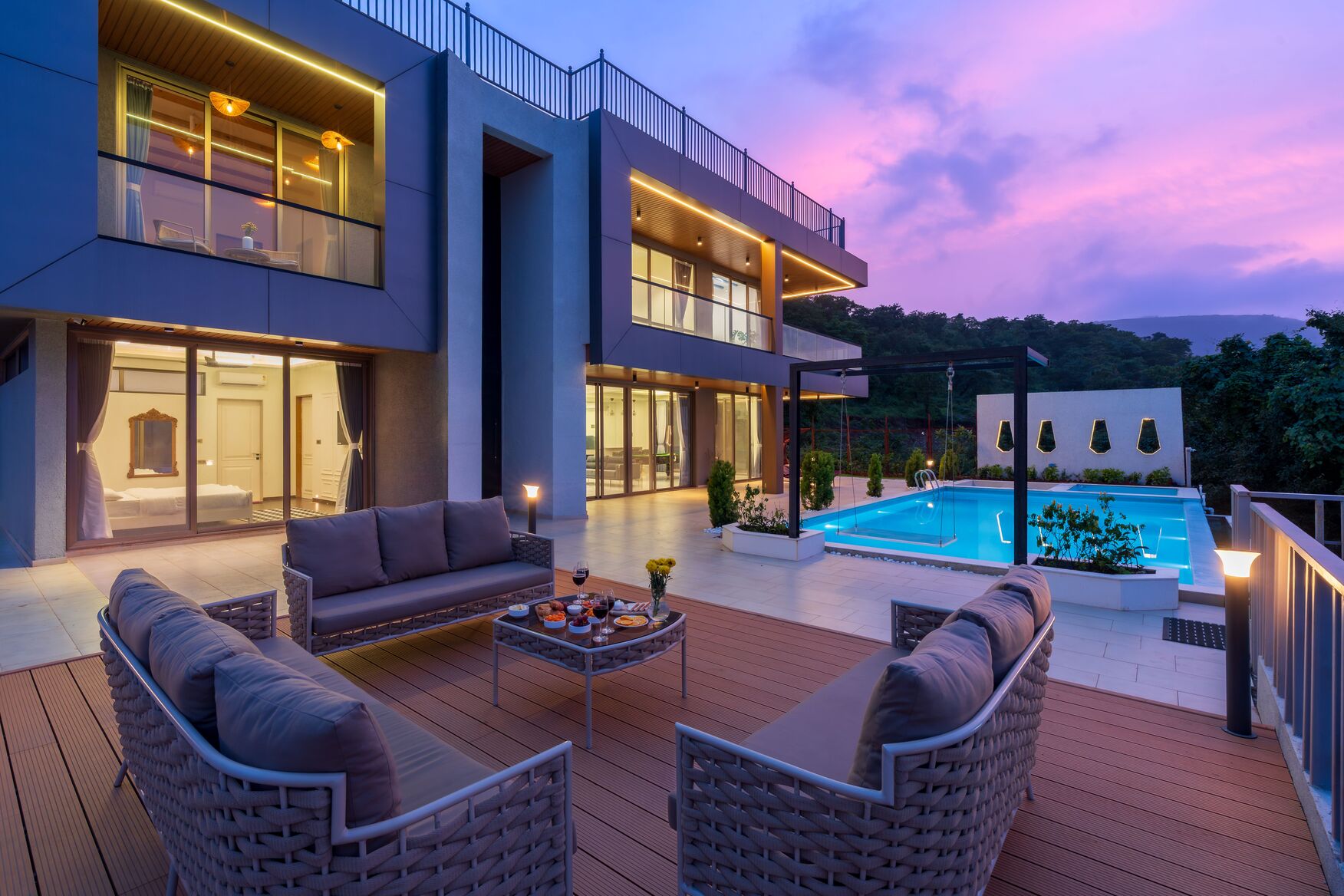 Luxury villa illuminated with outdoor torch lighting